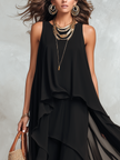 FJØRNA bohemian black layered chiffon maxi dress with flowing fabric and tiered design, perfect for boho-inspired style.