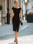 FJØRNA asymmetric draped cap sleeve midi dress displayed on a model, showcasing elegant design and flowing fabric.
