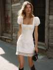 White stripe puff sleeve mini dress by FJØRNA, featuring short puff sleeves and a fitted silhouette.