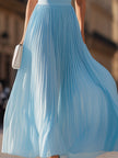 Sky blue halter pleated maxi dress by FJØRNA, flowing design with pleats and a halter neckline, perfect for elegant summer occasions.