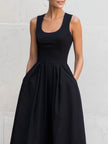 FJØRNA black sleeveless square-neck midi dress for women, showcasing a fitted silhouette and elegant design.