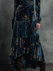 FJØRNA Quiet-boho Azure Mirage velvet wrap maxi dress with flowing fabric and bohemian style, worn by a model on a runway.