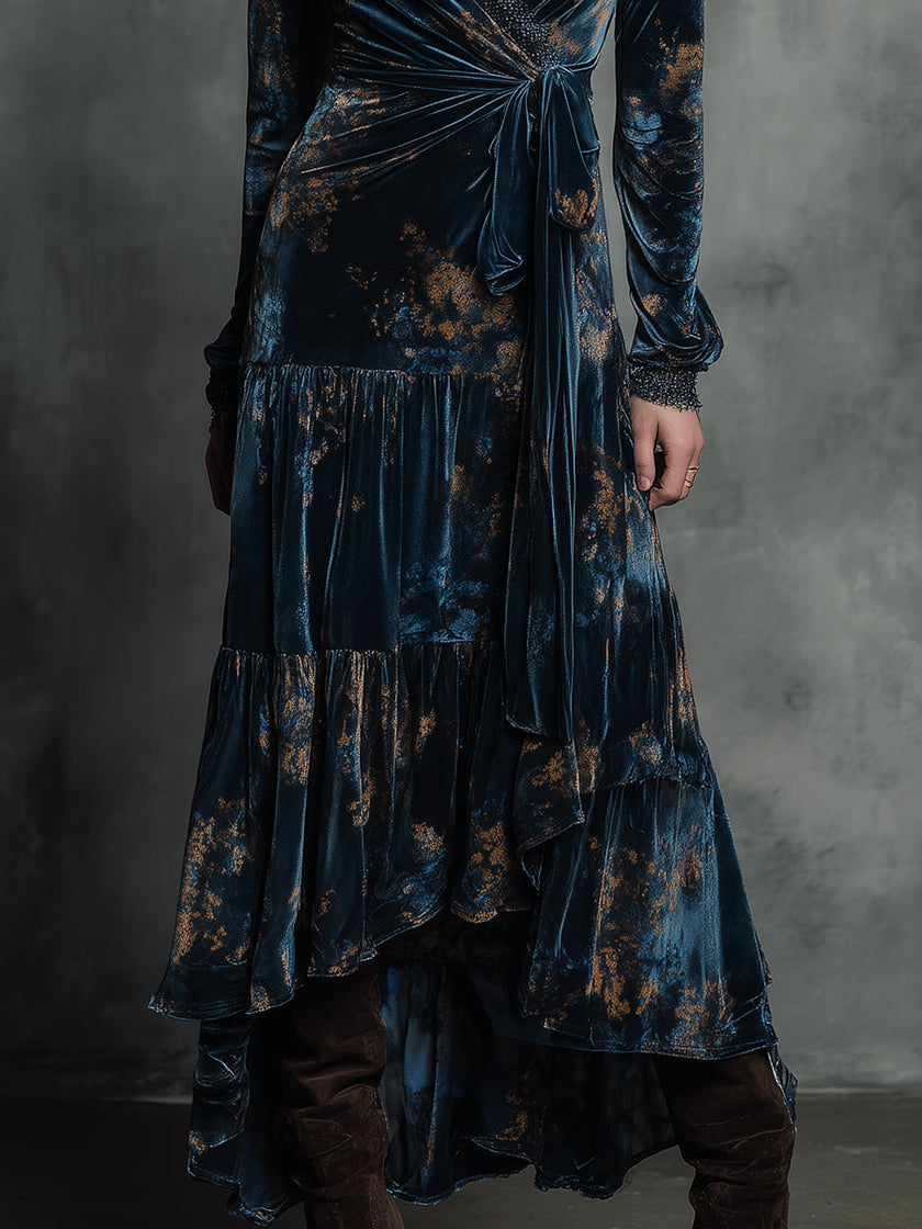 FJØRNA Quiet-boho Azure Mirage velvet wrap maxi dress with flowing fabric and bohemian style, worn by a model on a runway.