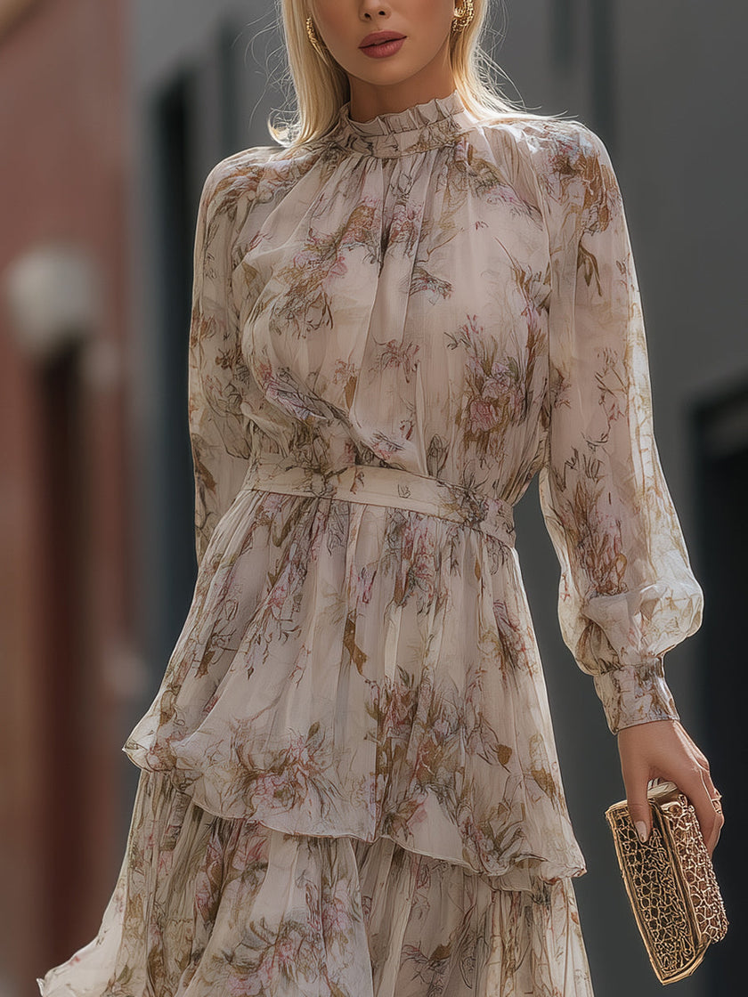 FJØRNA high neck tiered floral maxi dress with long sleeves and flowing skirt, featuring a colorful floral pattern.
