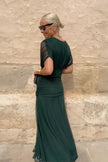 White FJØRNA floral print V-neck maxi dress with fantasy painted design, perfect for elegant parties and special occasions.