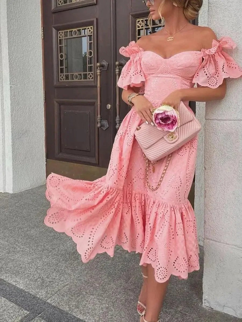 Pink FJØRNA off-shoulder midi dress for women, elegant A-line style, showcasing the flowing fabric and stylish neckline.