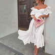 Pink off-shoulder midi dress for women by FJØRNA, featuring an elegant A-line design and flowing fabric.