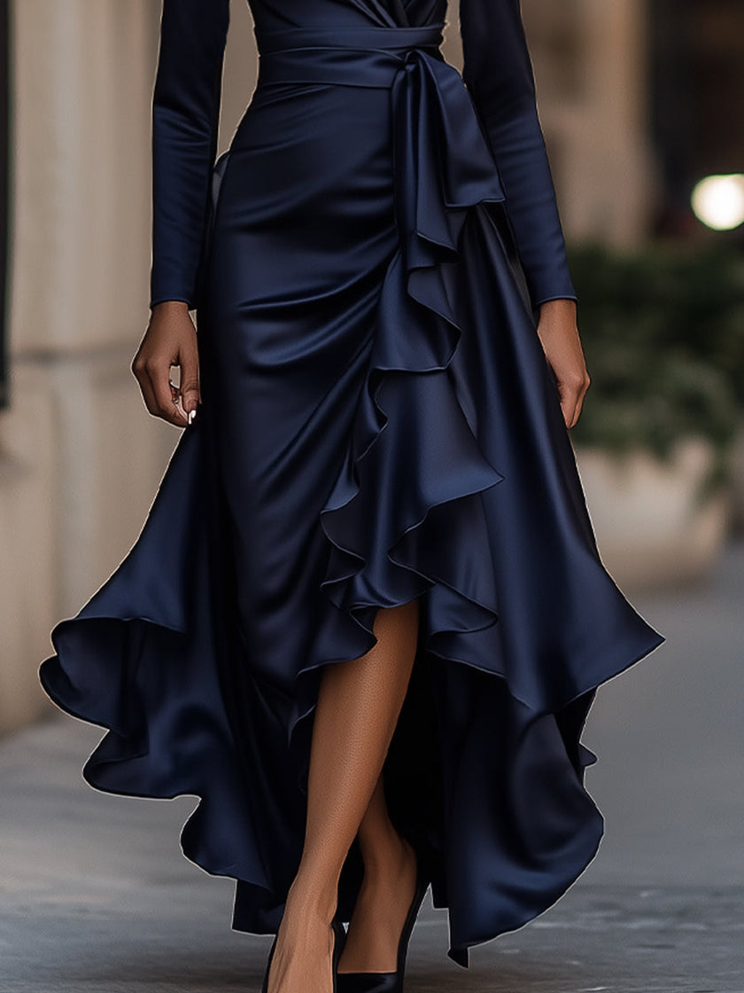 FJØRNA midnight blue satin maxi dress with draped design and ruffle details, elegant evening dress with flowing silhouette.