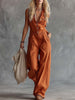 Rust orange cotton Western V-neck sleeveless jumpsuit by FJØRNA, featuring a fitted waist and wide-leg design.