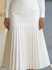 FJØRNA high-neck belted long-sleeve pleated midi dress for women, featuring a fitted waist and flowing skirt in a stylish design.