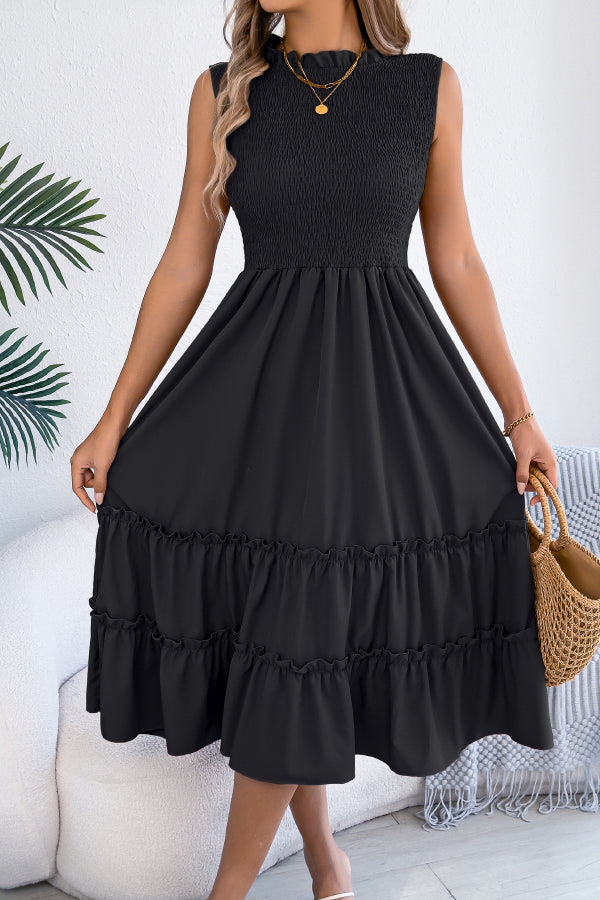 FJØRNA solid color sleeveless tucked patchwork casual midi dress displayed on a hanger with a flowing design and mixed fabric patches.