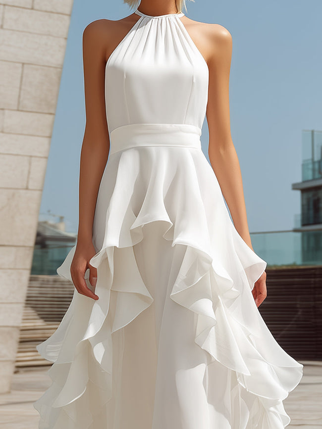 White FJØRNA halter layered ruffle maxi dress with flowy fabric and tiered ruffle details for elegant summer style.