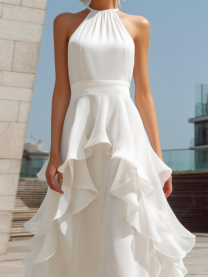 White FJØRNA halter layered ruffle maxi dress with flowy fabric and tiered ruffle details for elegant summer style.