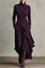 FJØRNA solid color high-neck long-sleeved irregular casual maxi dress displayed on a hanger.