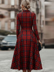 FJØRNA elegant long sleeve plaid dress featuring a classic yet contemporary design, showcased on a model against a neutral background.
