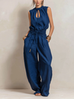 Dark blue cotton-linen women's jumpsuit by FJØRNA with round neck, sleeveless design, slim-fit, and pants style.