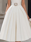 FJØRNA ivory halter neck pleated midi dress for women, elegant white dress with flowing pleats and halter neckline.