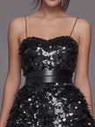 FJØRNA layered petal-sequin spaghetti strap mini dress with shimmering sequins and delicate floral-inspired design.