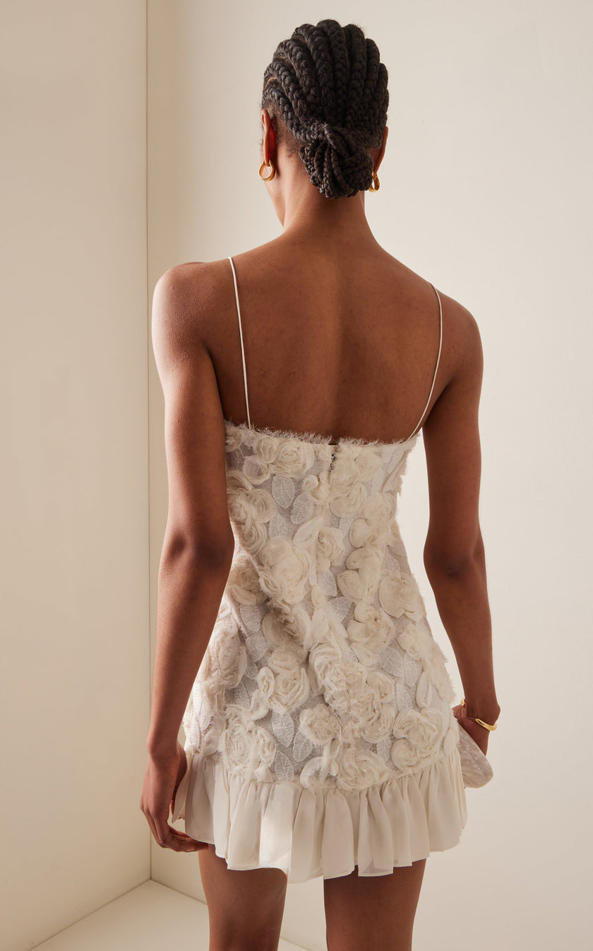 FJØRNA Blanc Rosette-Detailed Georgette Mini Dress with delicate floral rosette accents and lightweight, flowy fabric.