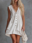 White lace V-neck mini dress by FJØRNA featuring delicate lace details and a casual V-neck design.
