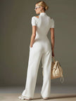 White cotton blend short sleeve wide-leg jumpsuit by FJØRNA, shown on a model with a relaxed fit and stylish design.