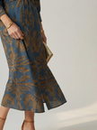 FJØRNA women's summer midi dress with long sleeves and wrap design, showcasing a flowy fabric and elegant style.