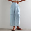 FJØRNA women's wide-leg denim trousers, casual pants with a relaxed fit, shown in a classic blue denim fabric.