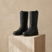 FJØRNA women's leather boots with ankle-high design, brown color, and lace-up front, stylish for casual or outdoor wear.