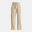 Women’s FJØRNA wide leg pants with elastic waist and pleated design, featuring flowing fabric and relaxed fit.