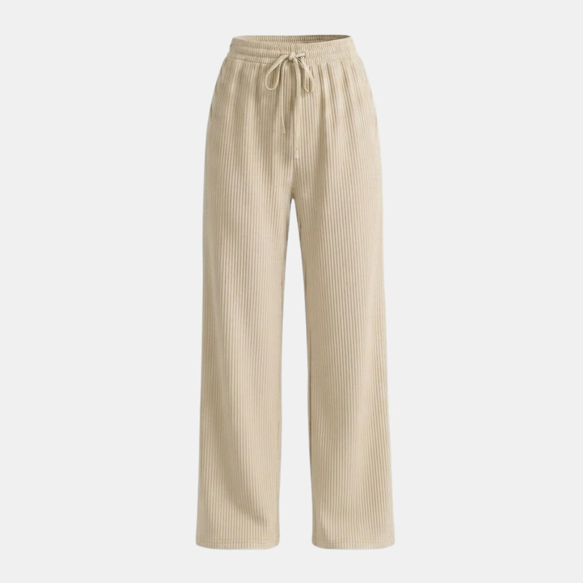 Women’s FJØRNA wide leg pants with elastic waist and pleated design, featuring flowing fabric and relaxed fit.