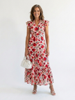 FJØRNA women's floral tiered summer midi dress showing lightweight fabric, floral pattern, and relaxed fit.