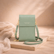 FJØRNA women's crossbody bag with adjustable strap and spacious interior, stylish accessory for daily use.