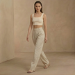 FJØRNA women's high waist wide leg pleated trousers, stylish and flowing pants with a relaxed fit and elegant design.