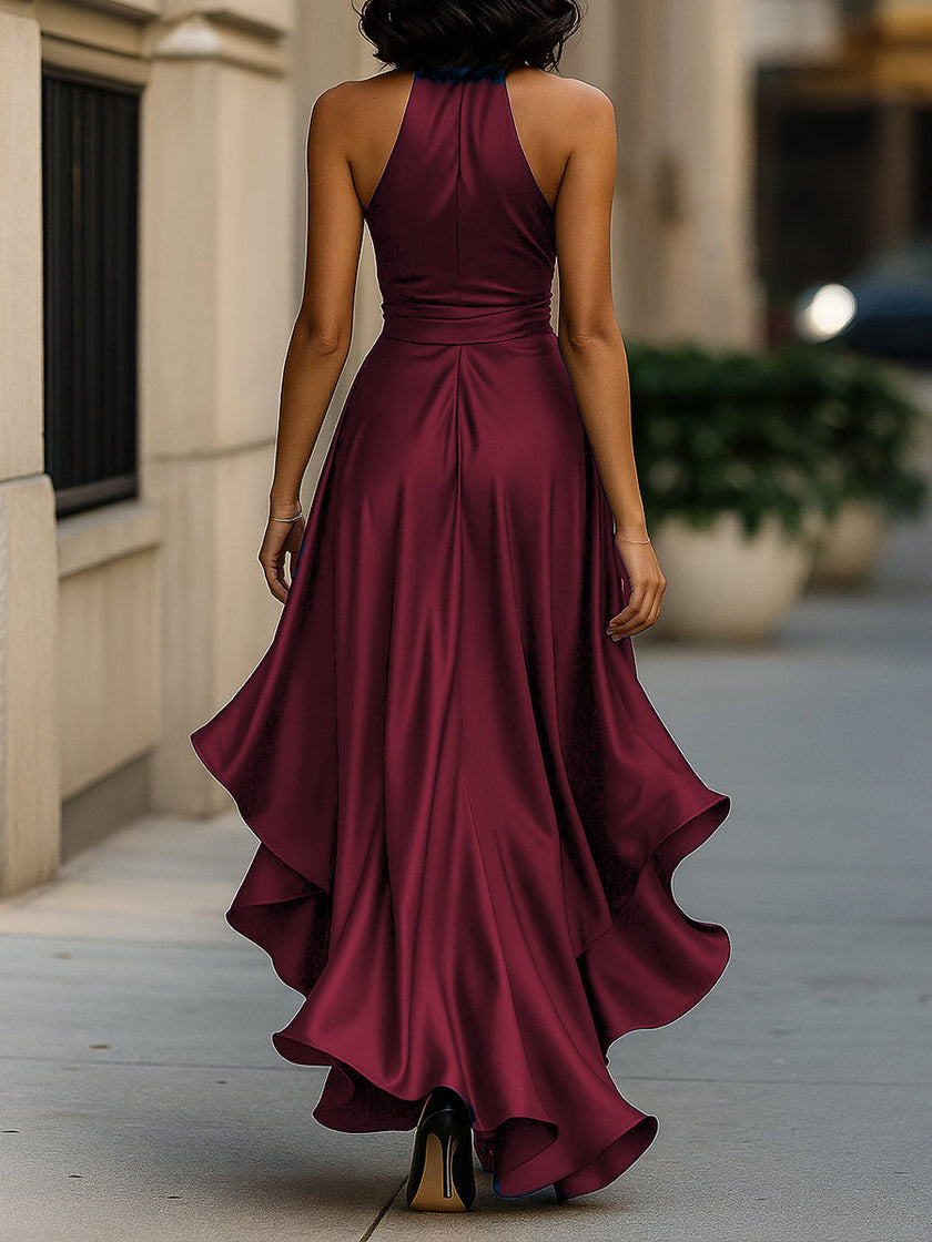 FJØRNA Midnight Elegance satin halter ruffle gown with flowing fabric and ruffled details, perfect for formal occasions.