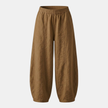 FJØRNA women's high waist cotton linen trousers with relaxed fit, shown on a model with natural pose and neutral background.