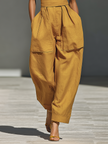 FJØRNA mustard linen-blend women's jumpsuit with crisscross neckline, relaxed fit, wide-leg pants, casual stylish attire