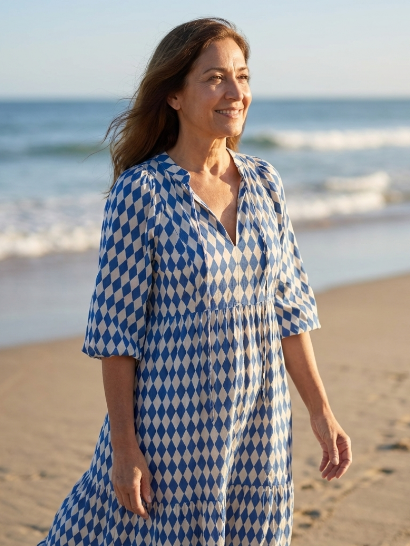 FJØRNA women's summer midi dress with print wrap design, lightweight fabric, and feminine silhouette for warm weather.