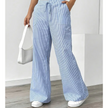FJØRNA lightweight summer trousers for women with drawstring waist, breathable fabric, and side pockets, ideal for warm weather.