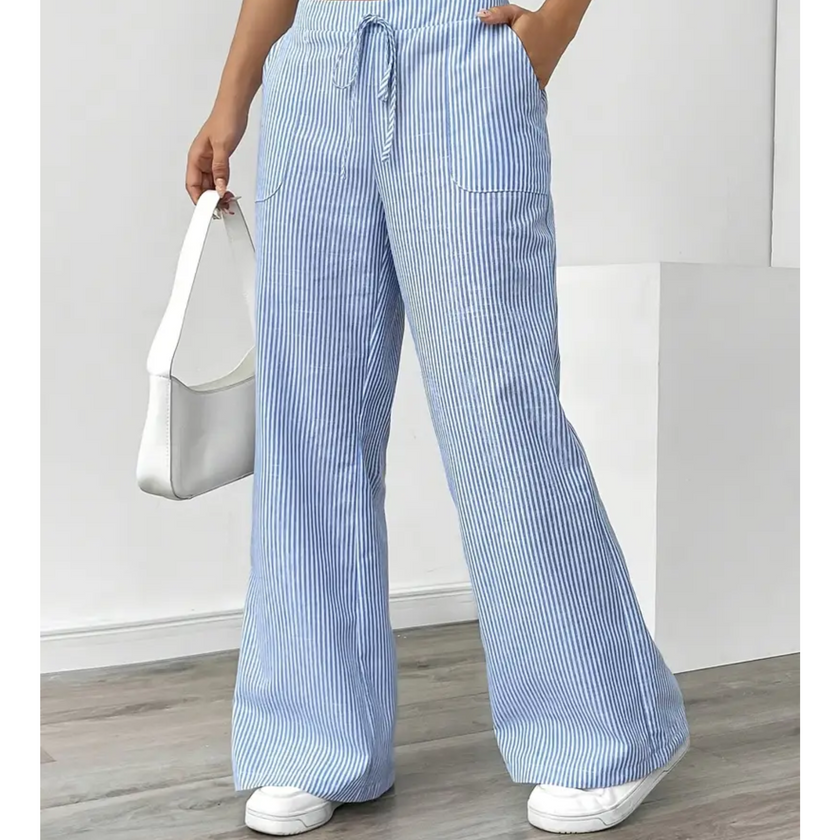 FJØRNA lightweight summer trousers for women with drawstring waist, breathable fabric, and side pockets, ideal for warm weather.