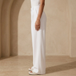 FJØRNA women's high waist wide leg tailored trousers, beige pants with a relaxed fit and pleated front, full length.