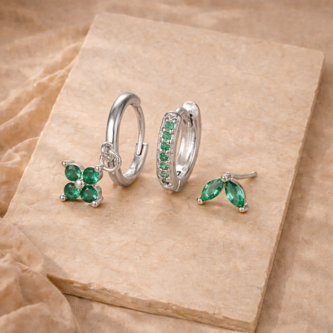 Unisex piercing set by FJØRNA featuring multiple jewelry pieces for women, showcasing various earrings and accessories.
