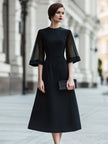 FJØRNA sheer sleeve midi dress with structured waist, showcasing elegant design and lightweight fabric for stylish wear.
