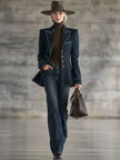 FJØRNA navy topstitched denim jacket for women, casual jacket with front pockets and button closure, styled on a model.