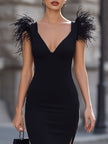 Black feather-accented deep V bodycon midi dress by FJØRNA, fitted dress with feather details and a plunging neckline.