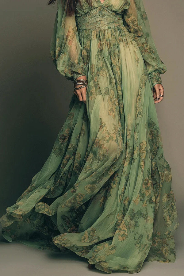 FJØRNA botanical print V-neck long-sleeved fitted waist casual maxi dress displayed with floral pattern and flowing silhouette.