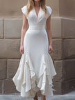 FJØRNA white ruffled hem midi gown with structured V-neck bodice, flowing maxi dress for women, elegant and stylish.