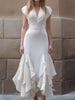 FJØRNA white ruffled hem midi gown with structured V-neck bodice, flowing maxi dress for women, elegant and stylish.