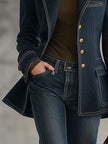 Navy topstitched denim jacket for women by FJØRNA, featuring classic design and detailed stitching, shown on a model.