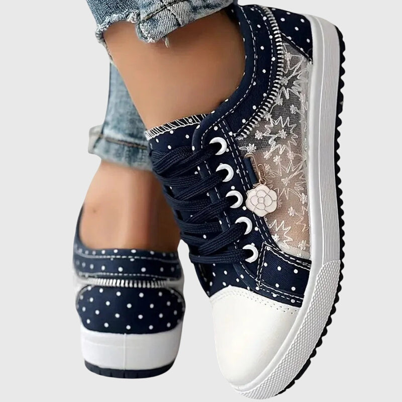 FJØRNA Elyana™ orthopedic sneakers with supportive design, white and gray color, cushioned soles, and breathable materials.