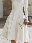 FJØRNA zip-front long sleeve fit-and-flare midi dress for women, shown in black with a fitted bodice and flared skirt.